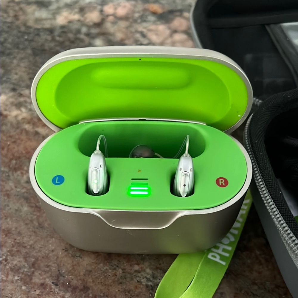 Phonak Silver Hearing Aids kit. Includes charging case carrying case.